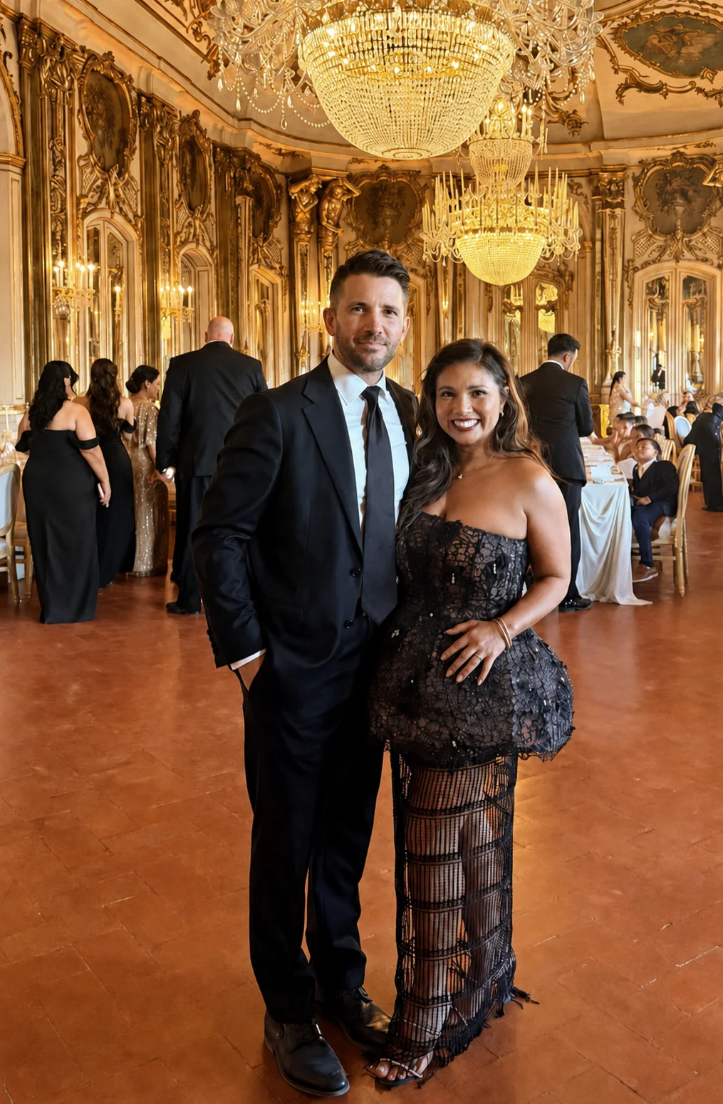 A client wearing a black lace evening dress in a grand interior